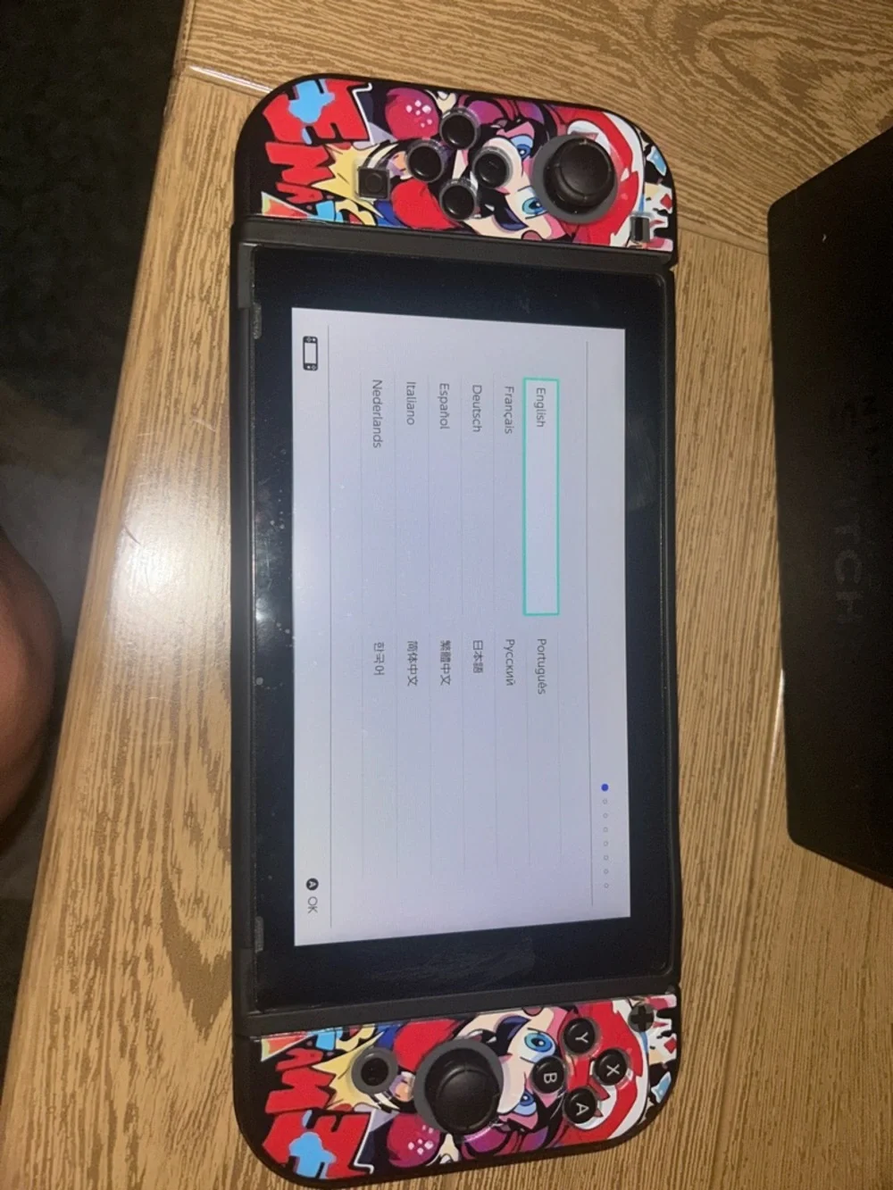 Nintendo Switch with Red, Blue, Black Graphic Controller Wraps